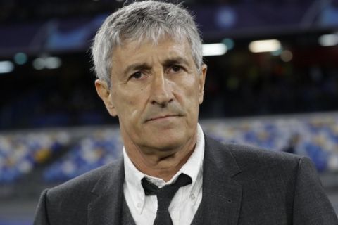 Barcelona coach Quique Setien waits for the start of the Champions League, Round of 16, first-leg soccer match between Napoli and Barcelona, at the San Paolo Stadium in Naples, Italy, Tuesday, Feb. 25, 2020. (AP Photo/Andrew Medichini)
