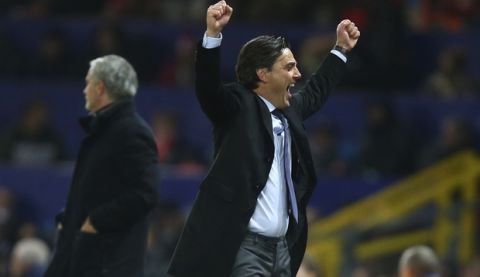Sevilla's head coach Vicenzo Montella celebrates after his sides scored their second goal of the game during the Champions League round of 16 second leg soccer match between Manchester United and Sevilla, at Old Trafford in Manchester, England, Tuesday, March 13, 2018. (AP Photo/Dave Thompson)