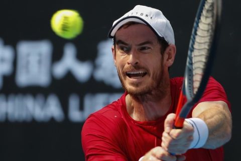 Andy Murray of Britain hits a return shot against his compatriot Cameron Norrie during their second round of the men's singles match in the China Open tennis tournament at the Diamond Court in Beijing, Wednesday, Oct. 2, 2019. (AP Photo/Andy Wong)