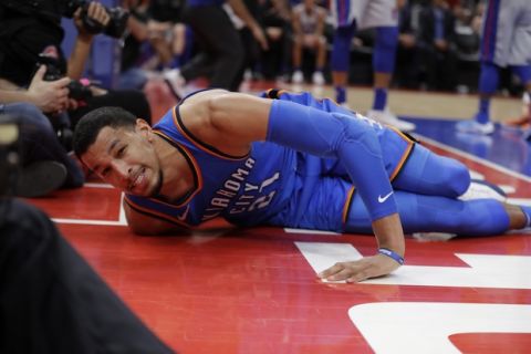Oklahoma City Thunder guard Andre Roberson lies on the court after slipping during the second half of the team's NBA basketball game against the Detroit Pistons, Saturday, Jan. 27, 2018, in Detroit. (AP Photo/Carlos Osorio)