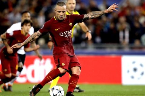 Roma's Radja Nainggolan scores his side's fourth goal during the Champions League semifinal second leg soccer match between Roma and Liverpool at the Olympic Stadium in Rome, Wednesday, May 2, 2018. (AP Photo/Andrew Medichini)