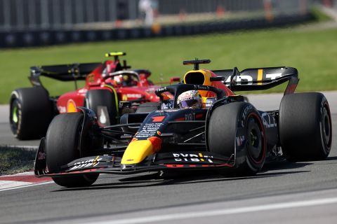 MONTREAL, QUEBEC - JUNE 19: Max Verstappen of the Netherlands driving the (1) Oracle Red Bull Racing RB18 leads Carlos Sainz of Spain driving (55) the Ferrari F1-75 during the F1 Grand Prix of Canada at Circuit Gilles Villeneuve on June 19, 2022 in Montreal, Quebec. (Photo by Peter Fox/Getty Images)