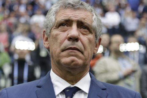 Portugal coach Fernando Santos waits for the kick-off of the Confederations Cup, Group A soccer match between New Zealand and Portugal, at the St. Petersburg Stadium, Russia, Saturday, June 24, 2017. (AP Photo/Ivan Sekretarev)