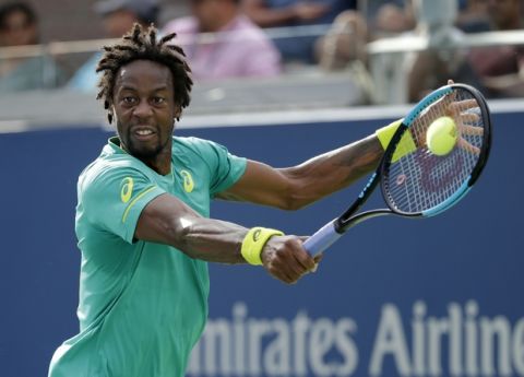 Gael Monfils, of France, returns a shot from Donald Young, of the United States, during the second round of the U.S. Open tennis tournament, Thursday, Aug. 31, 2017, in New York. (AP Photo/Seth Wenig)