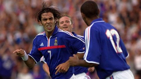 Robert Pires of France, left,jubilates after he scored a goal, with Thierry Henry, foreground, and Emmanuel Petit, background  during their friendly soccer match against Denmark in Nantes, La Beaujoire Stadium, western France, Wednesday, Aug.15, 2001. (AP Photo/Franck Prevel)