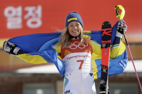 Gold medal winner Frida Hansdotter, of Sweden, celebrates in the finish area after the Women's Slalom at the 2018 Winter Olympics in Pyeongchang, South Korea, Friday, Feb. 16, 2018. (AP Photo/Morry Gash)