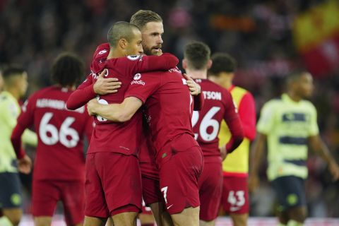 Liverpool players celebrate at the end of the English Premier League soccer match between Liverpool and Manchester City at Anfield stadium in Liverpool, Sunday, Oct. 16, 2022. (AP Photo/Jon Super)