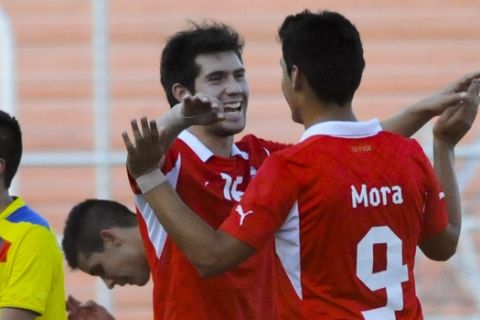Chile's Felipe Mora, right, celebrates with teammate Cesar Fuentes after scoring against Ecuador during a U-20 South American soccer championship match in Mendoza, Argentina, Wednesday, Jan. 23, 2013. (AP Photo/Walter Moreno)