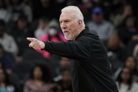 San Antonio Spurs coach Gregg Popovich signals to players during the first half of an NBA basketball game against the Utah Jazz, Friday, March 11, 2022, in San Antonio. (AP Photo/Eric Gay)