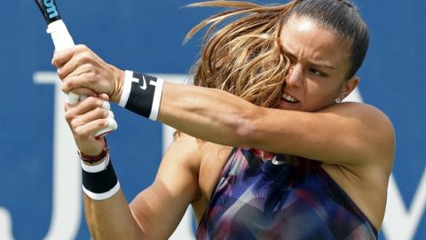 Maria Sakkari, of Greece, returns a shot from Kiki Bertens, of Netherlands, during the first round of the U.S. Open tennis tournament, Monday, Aug. 28, 2017, in New York. (AP Photo/Michael Noble)