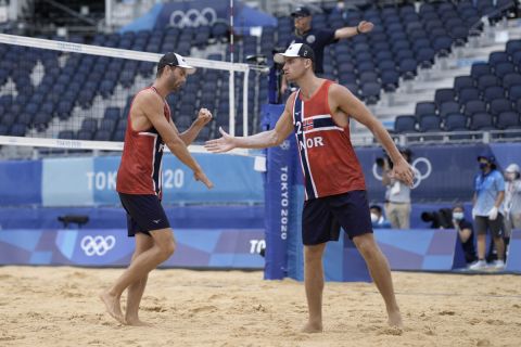 Anders Berntsen Mol, left, of Norway, celebrates a play with teammate Christian Sandlie Sorum during a men's beach volleyball Gold Medal match against the Russian Olympic Committee at the 2020 Summer Olympics, Saturday, Aug. 7, 2021, in Tokyo, Japan. (AP Photo/Petros Giannakouris)