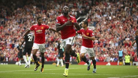 Manchester United's Romelu Lukaku celebrates scoring his side's first goal of the game during the English Premier League soccer match between Manchester United and West Ham United at Old Trafford in Manchester, England, Sunday, Aug. 13, 2017. (AP Photo/Dave Thompson)
