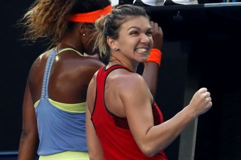 Romania's Simona Halep celebrates after defeating Japan's Naomi Osaka during their fourth round match at the Australian Open tennis championships in Melbourne, Australia, Monday, Jan. 22, 2018. (AP Photo/Ng Han Guan)
