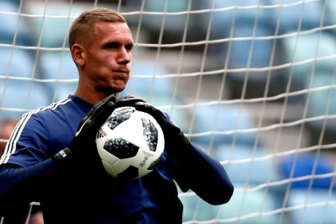 Sweden goalkeeper Robin Olsen stops a ball during a training session on the eve of Sweden's Group F match against Germany, during the 2018 soccer World Cup in Sochi, Russia, Friday, June 22, 2018. (AP Photo/Rebecca Blackwell)