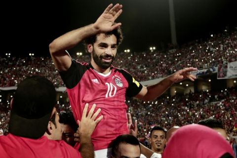 Egypt's Mohamed Salah celebrates defeating Congo during the 2018 World Cup group E qualifying soccer match at the Borg El Arab Stadium in Alexandria, Egypt, Sunday, Oct. 8, 2017. Egypt won 2-1. (AP Photo/Nariman El-Mofty)
