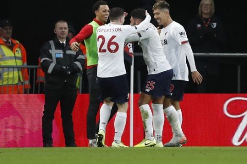 Liverpool's Alex Oxlade-Chamberlain, center right, celebrates with teammates after scoring his side's opening goal during the English Premier League soccer match between Bournemouth and Liverpool at the Vitality stadium in Bournemouth, England, Saturday, Dec. 7, 2019. (AP Photo/Alastair Grant)