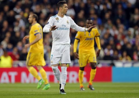 Real Madrid's Cristiano Ronaldo reacts after Juventus' Mario Mandzukic scored his side's opening goal during a Champions League quarter-final, 2nd leg soccer match between Real Madrid and Juventus at the Santiago Bernabeu stadium in Madrid, Spain, Wednesday, April 11, 2018. (AP Photo/Paul White)