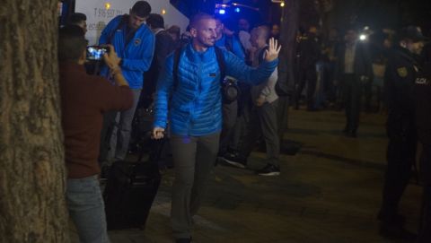 Boca Juniors players arrive at their hotel in Madrid, Spain, Wednesday, Dec. 5, 2018. The Copa Libertadores Final will be played on Dec. 9 in Spain at Real Madrid's stadium for security reasons after River Plate fans attacked the Boca Junior team bus heading into the Buenos Aires stadium for the meeting of Argentina's fiercest soccer rivals last Saturday. (AP Photo/Paul White)