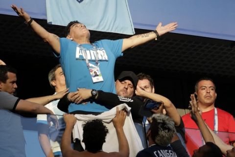 Argentina former soccer star Diego Maradona waves to the fans ahead of the group D match between Argentina and Nigeria, at the 2018 soccer World Cup in the St. Petersburg Stadium in St. Petersburg, Russia, Tuesday, June 26, 2018. (AP Photo/Petr David Josek)