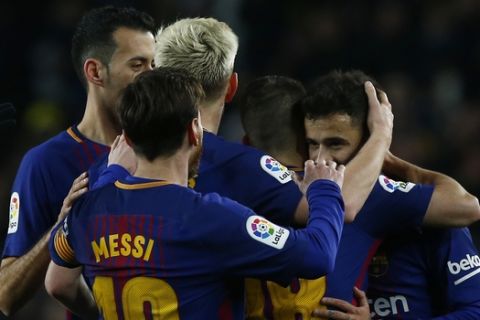 FC Barcelona's Coutinho, right, celebrates with this teammates after scoring  during the Spanish La Liga soccer match between FC Barcelona and Girona at the Camp Nou stadium in Barcelona, Spain, Saturday, Feb. 24, 2018. (AP Photo/Manu Fernandez)