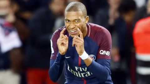 Paris Saint Germain's Kylian Mbappe reacts after scoring the second goal against Lyon during their French League One soccer match between PSG and Olympique Lyon at the Parc des Princes stadium in Paris, France, Sunday, Sept. 17, 2016. (AP Photo/Francois Mori)
