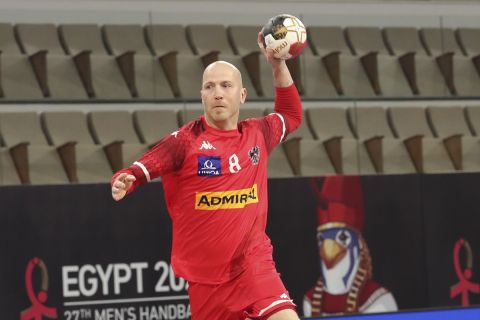 Austria's Robert Weber shoots during the World Handball Championship between Austria and Morocco in Cairo, Egypt, Wednesday, Jan. 20, 2021. (Khaled Elfiqit, Pool via AP)