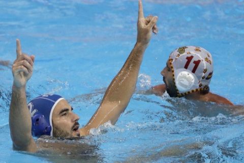 Italy's Francesco Di Fulvio celebrates after scoring a goal against Spain during their men's water polo gold medal match at the World Swimming Championships in Gwangju, South Korea, Saturday, July 27, 2019. (AP Photo/Mark Schiefelbein)