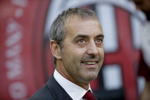 AC Milan's manager Marco Giampaolo looks up prior to the Serie A soccer match between AC Milan and Brescia, at the San Siro stadium in Milan, Italy, Saturday, Aug. 31, 2019. (AP Photo/Luca Bruno)
