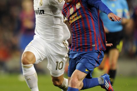 Barcelona's Argentinian forward Lionel Messi  (R) vies with Real Madrid's German midfielder Mesut Ozil (L) during the second leg of the Spanish Cup quarter-final "El clasico" football match Barcelona vs Real Madrid at the Camp Nou stadium in Barcelona on January 25, 2012.  AFP PHOTO/ PEDRO ARMESTRE (Photo credit should read PEDRO ARMESTRE/AFP/Getty Images)