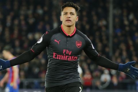 Arsenal's Alexis Sanchez celebrates after scoring his side's third goal of the game during their English Premier League soccer match between Crystal Palace and Arsenal at Selhurst Park stadium in London, Thursday, Dec. 28, 2017. (AP Photo/Alastair Grant)