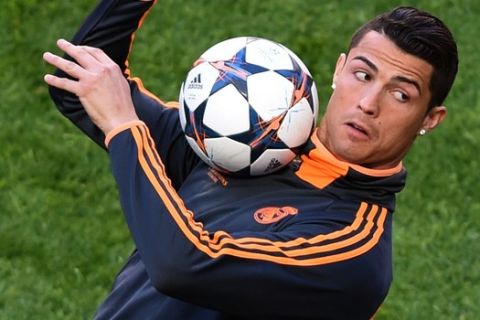 Real's Cristiano Ronaldo, controls the ball, during a training session ahead of Saturday's Champions League final soccer match between Real Madrid and Atletico Madrid, in Luz stadium in Lisbon, Portugal, Friday, May 23, 2014. (AP Photo/Paulo Duarte)
