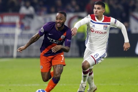 Manchester City midfielder Raheem Sterling, left, outruns Lyon midfielder Houssem Aouar during their Champions League Group F second leg soccer match between Lyon and Manchester City in Decines, near Lyon, central France, Tuesday, Nov. 27, 2018. (AP Photo/Laurent Cipriani) o