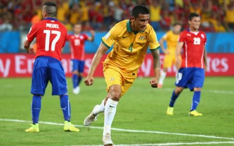 CUIABA, BRAZIL - JUNE 13:  Tim Cahill of Australia celebrates scoring his teams first goal during the 2014 FIFA World Cup Brazil Group B match between Chile and Australia at Arena Pantanal on June 13, 2014 in Cuiaba, Brazil.  (Photo by Clive Brunskill/Getty Images)