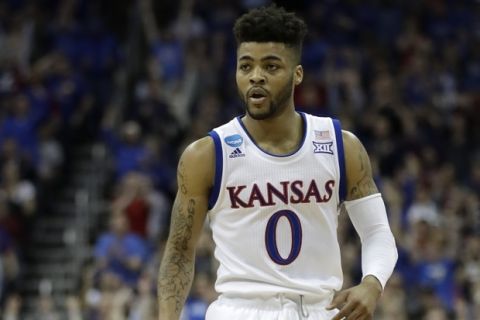 Kansas guard Frank Mason III walks up court during the first half of a regional final against Oregon in the NCAA men's college basketball tournament, Saturday, March 25, 2017, in Kansas City, Mo. (AP Photo/Charlie Riedel)