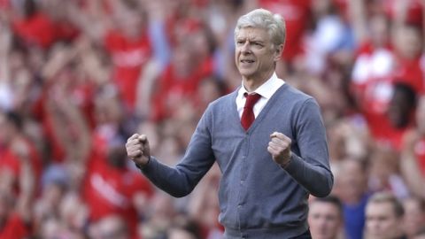 Arsenal's French manager Arsene Wenger celebrates his side's second goal during the English Premier League soccer match between Arsenal and Burnley at the Emirates Stadium in London, Sunday, May 6, 2018. The match is Arsenal manager Arsene Wenger's last home game in charge after announcing in April he will stand down as Arsenal coach at the end of the season after nearly 22 years at the helm. (AP Photo/Matt Dunham)