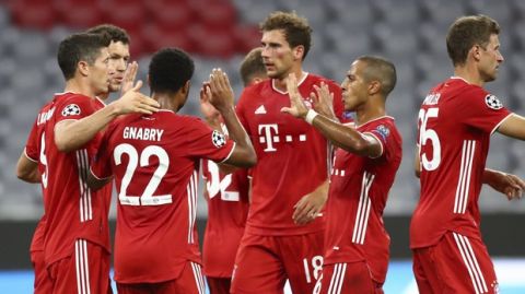 Bayern's Ivan Perisic, second left, celebrates with teammates after scoring his team's second goal during the Champions League round of 16 second leg soccer match between Bayern Munich and Chelsea at Allianz Arena in Munich, Germany, Saturday, Aug. 8, 2020. (AP Photo/Matthias Schrader)
