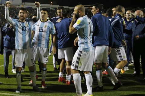 Argentina's Lionel Messi, left, celebrates with his team after beating Ecuador during their 2018 World Cup qualifying soccer match at the Atahualpa Olympic Stadium in Quito, Ecuador, Tuesday, Oct. 10, 2017. (AP Photo/Fernando Vergara)