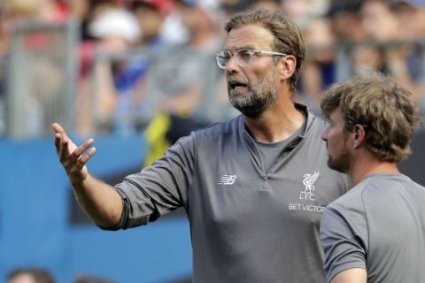 Liverpool manager Jurgen Klopp directs his team against Borussia Dortmund during the second half of an International Champions Cup tournament soccer match in Charlotte, N.C., Sunday, July 22, 2018. (AP Photo/Chuck Burton)