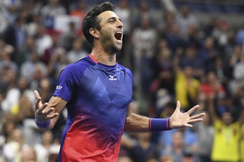 Robert Farah, of Colombia, reacts after winning the men's doubles final with partner Juan Sebastian Cabal, of Colombia, against Marcel Granollers, of Spain, and Horacio Zeballos, of Argentina, during the final match of the U.S. Open tennis championships Friday, Sept. 6, 2019, in New York. (AP Photo/Sarah Stier)