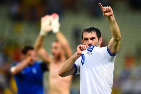 FORTALEZA, BRAZIL - JUNE 24: Giorgos Karagounis of Greece celebrates after defeating the Ivory Coast 2-1 during the 2014 FIFA World Cup Brazil Group C match between Greece and the Ivory Coast at Castelao on June 24, 2014 in Fortaleza, Brazil.  (Photo by Jamie McDonald/Getty Images)