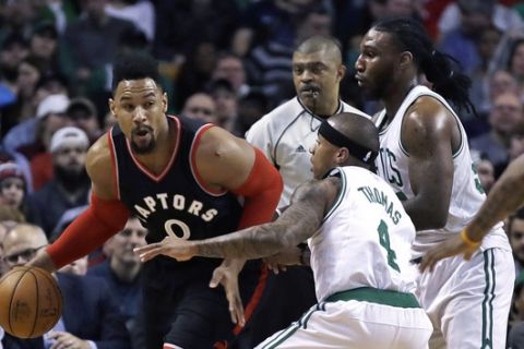 Toronto Raptors center Jared Sullinger (0) is trailed by Boston Celtics guard Isaiah Thomas (4) and forward Jae Crowder during the first quarter of an NBA basketball game in Boston, Wednesday, Feb. 1, 2017. (AP Photo/Charles Krupa)