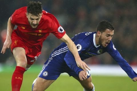 Chelsea's Eden Hazard, right, competes for the ball with Liverpool's Adam Lallana during the English Premier League soccer match between Liverpool and Chelsea at Anfield stadium in Liverpool, England, Tuesday, Jan. 31, 2017. (AP Photo/Dave Thompson)