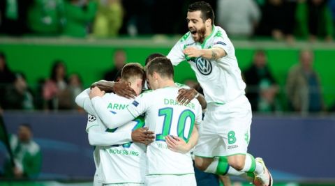 "WOLFSBURG, GERMANY - APRIL 06: Maximilian Arnold (1st L) of Wolfsburg celebrates scoring his team's second goal with his team mates during the UEFA Champions League Quarter Final First Leg match between VfL Wolfsburg and Real Madrid at Volkswagen Arena on April 6, 2016 in Wolfsburg, Germany.  (Photo by Oliver Hardt/Bongarts/Getty Images)"