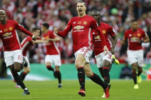 United's Zlatan Ibrahimovic, center, celebrates after scoring the opening goal during the English League Cup final soccer match between Manchester United and Southampton FC at Wembley stadium in London, Sunday, Feb. 26, 2017. (AP Photo/Kirsty Wigglesworth)
