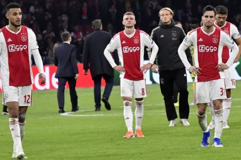 Ajax players walk on the pitch at the end of the Champions League semifinal second leg soccer match between Ajax and Tottenham Hotspur at the Johan Cruyff ArenA in Amsterdam, Netherlands, Wednesday, May 8, 2019. (AP Photo/Martin Meissner)