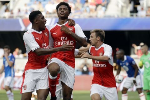Arsenal forward Chuba Akpom, center, celebrates his goal with teammate Alex Iwobi, left, during the second half of the MLS All-Star soccer game against the MLS All-Stars on Thursday, July 28, 2016, in San Jose, Calif. Arsenal won 2-1. (AP Photo/Marcio Jose Sanchez)