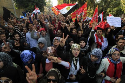 Egyptians chant slogans as thousands march in a protest from Al-Ahly club to the headquarters of the ministry of interior in Cairo on February 2, 2012 against the previous day's deadly riots after a football match. Egypt began three days of mourning after 74 people were killed in an eruption of violence at a football match that sparked new anger against the military rulers for failing to ensure security. AFP PHOTO/MAHMUD HAMS (Photo credit should read MAHMUD HAMS/AFP/Getty Images)