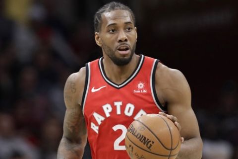 Toronto Raptors' Kawhi Leonard drives against the Cleveland Cavaliers in the second half of an NBA basketball game, Monday, March 11, 2019, in Cleveland. (AP Photo/Tony Dejak)