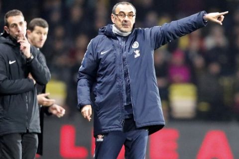 Chelsea's team manager Maurizio Sarri, center, gives instructions during the English Premier League soccer match between Watford and Chelsea at Vicarage Road stadium in Watford, England on Wednesday, Dec. 26, 2018. (AP Photo/Frank Augstein)
