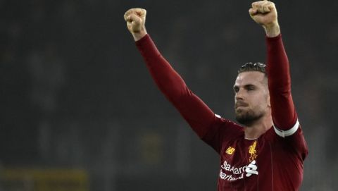 Liverpool's Jordan Henderson celebrates at the end of the English Premier League soccer match between Wolverhampton Wanderers and Liverpool at the Molineux Stadium in Wolverhampton, England, Thursday, Jan. 23, 2020. (AP Photo/Rui Vieira)